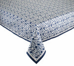 The Alfresco Tablecloth by Kim Seybert features a blue and white geometric design inspired by traditional Indian block printing and is made from 100% cotton.