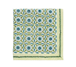 From the Majorelle Tablecloth Collection by Kim Seybert, this square cloth napkin features blue and green florals with green leaves and a striped border, handmade with Indian block-printing on crisp white.
