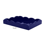 The Addison Ross Scalloped Navy Lacquer Tray Collection features small rectangular trays with a glossy finish, elegant scalloped edges, and subtle branding.