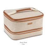 A beige textured train case with brown trim, zipper closure, and top handle from Stephanie Johnson's Tropea Travel Collection. Features removable compartments for organized storage and easy access to essentials.