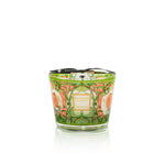 The Baobab Collection Tomorrowland Candle, inspired by Art Nouveau, features a floral and leaf design, enhanced by a black ribbon and label on the front.