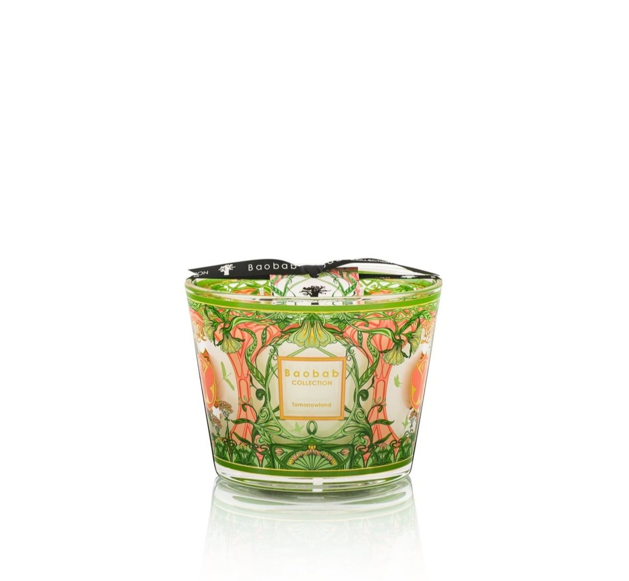 The Baobab Collection Tomorrowland Candle, inspired by Art Nouveau, features a floral and leaf design, enhanced by a black ribbon and label on the front.