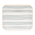 The Sugar Paper Dusty Blue Stripe Trinket Tray is a rectangular ceramic tray with rounded corners, horizontal dusty blue stripes, and a thin yellow border accented by subtle gold details.