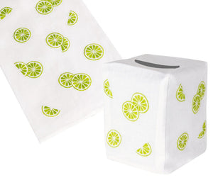 The Haute Home Lime Slice Bath Collection features white Italian linen items with a green lime slice pattern, including a hand-embroidered rectangular tissue box cover and matching cloth.