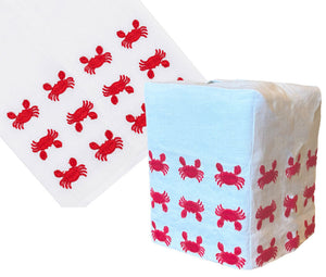 The Haute Home Mini Crab Bath Collection, Red, features a hand-embroidered Italian linen tissue box cover with red crab designs on a white background, displayed both flat and wrapped around a rectangular box.