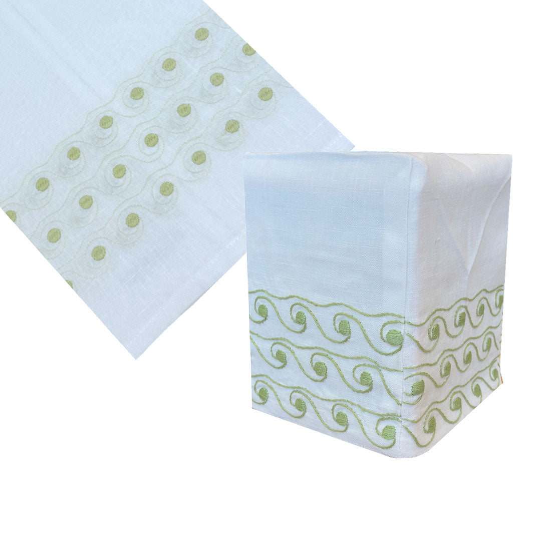 The Breakers Bath Collection by Haute Home features a white Italian linen tissue box cover with light green wavy embroidery and dotted borders.