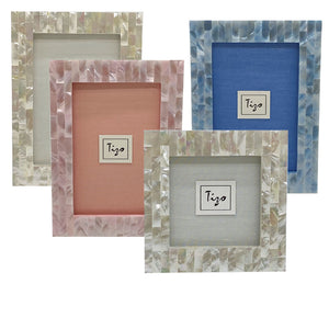 The Mother of Pearl Frame Collection by Tizo Design features four unique frames with mosaic borders in white, pink, and blue tones. Each frame’s distinct background brings iridescent magic to your gallery wall.