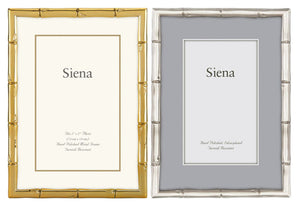 Two rectangular photo frames by Tizo Design are shown side by side; the left is a gold Siena Bamboo Silverplate Frame with a white mat, the right is silver with a gray mat. Both display "Siena" and are ideal for cherished memories.