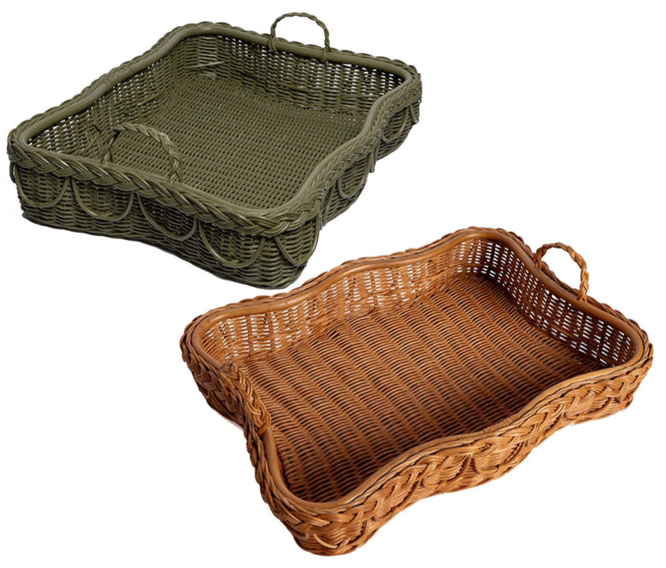 The Hadley Tray Collection by Sharland England features two hand-crafted rectangular wicker baskets with handles, one green and one brown, each with a subtle scalloped edge, displayed on a white background.