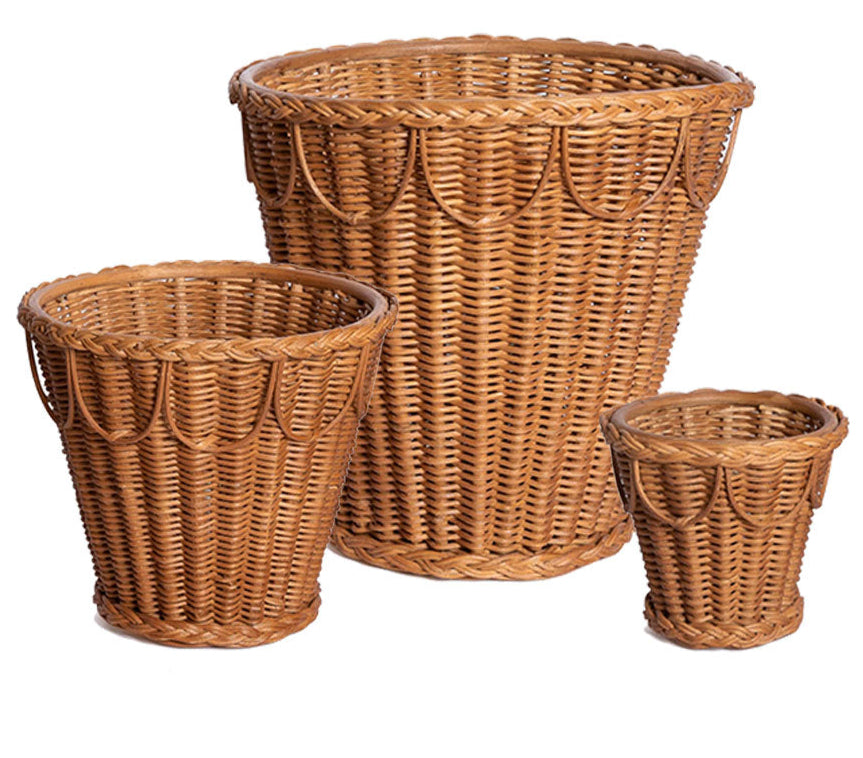 The Pinet Plant Pot Collection by Sharland England features three brown wicker cachepot baskets in varying sizes, displayed side by side on a white background—perfect as stylish houseplant holders.