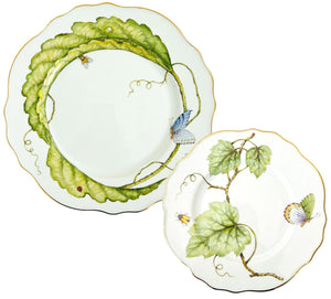 From the Garden Leaves Dinnerware Collection by Anna Weatherley, these two hand-painted porcelain plates feature scalloped edges, green leaf motifs, butterflies, insects, and elegant gold trim.