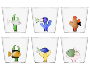 Six glass cups from the Ichendorf Milano Marine Garden Drinkware Collection, each handmade with a glass fish and decorative coral at the base, displayed in two rows of three.