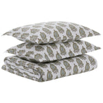 The Nilay Leaf Bedding Collection by John Robshaw includes two pillowcases and a flat sheet with a green and gold paisley design on white, offering luxury comfort to pair perfectly with your organic cotton duvet.