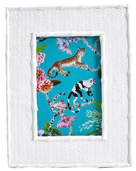 A Two's Company Liana Photo Frames Collection frame encasing a fabric with a vibrant leopard and floral print.
