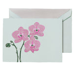 The Crane Violet Orchid Folded Card Set features an exotic orchid illustration on the front, matched with a light-colored envelope and printed on elegant Beach Glass paper.