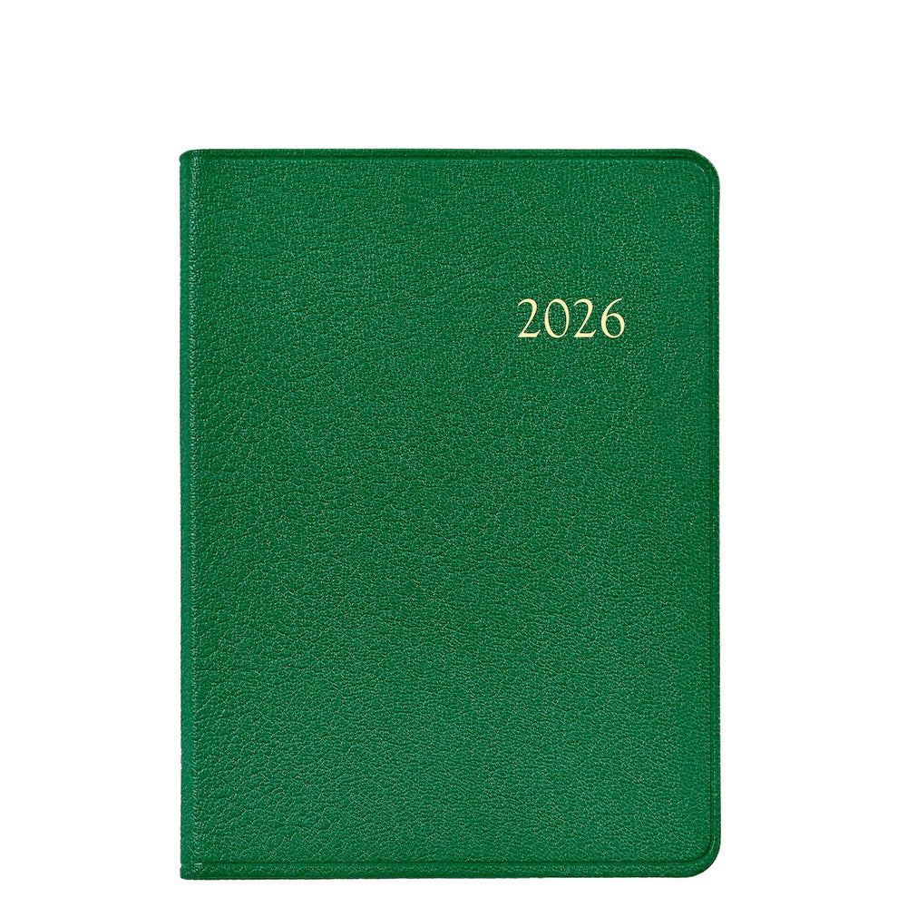 The Graphic Image 2026 Weekly Journal Planner Collection features a green leather planner with "2026" embossed in gold and appointment pages, displayed on a white background.