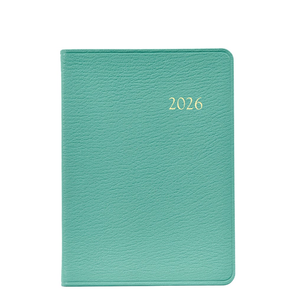 A closed teal leather journal from the Graphic Image 2026 Weekly Journal Planner Collection, featuring "2026" in gold on the cover, displayed against a white background.