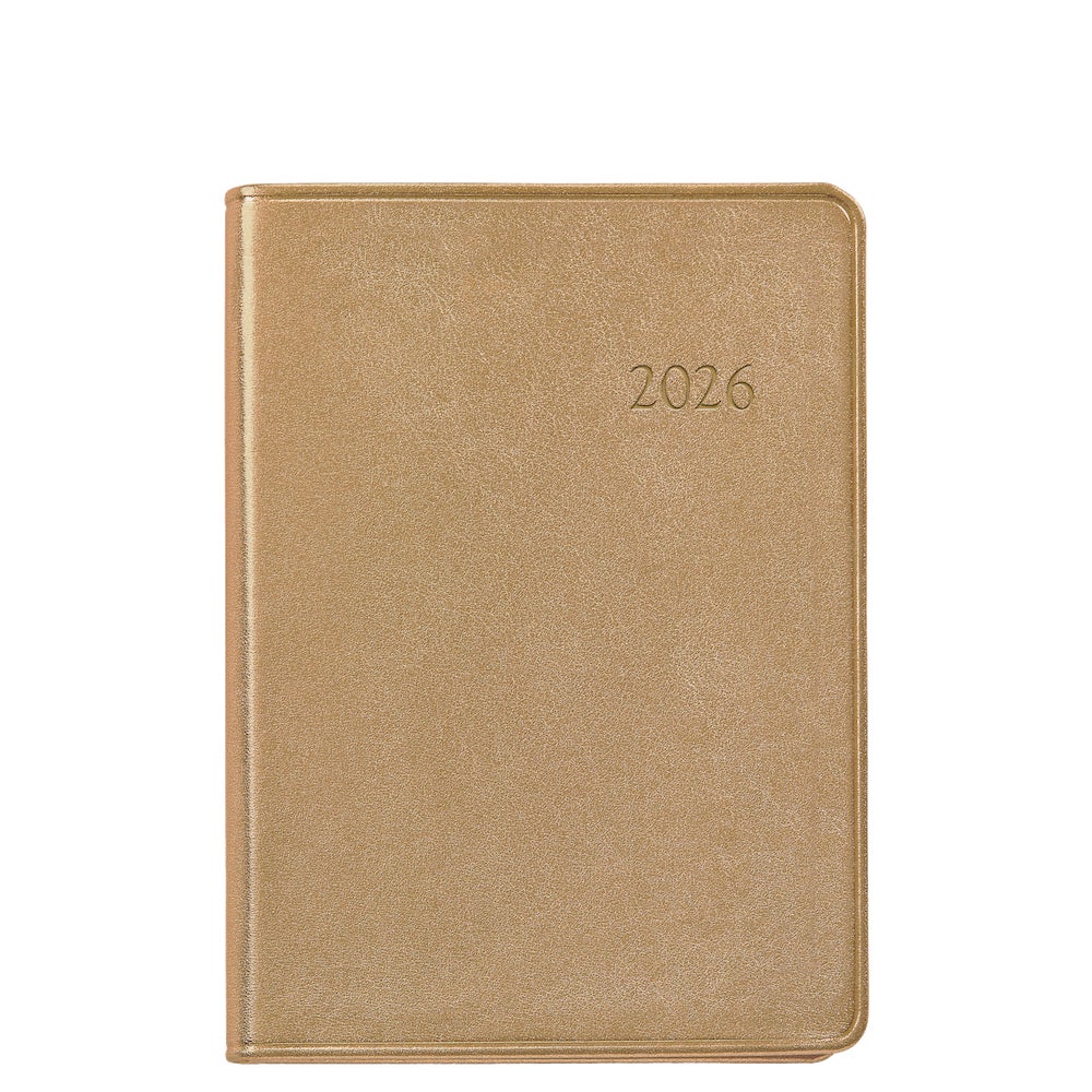 The Graphic Image 2026 Weekly Journal Planner Collection features a closed, gold-colored leather notebook with "2026" embossed on the front cover.