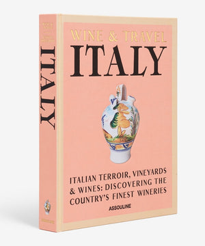 Assouline's "Wine & Travel Italy," featuring a pink cover adorned with a decorative vase illustration, is an essential read for anyone passionate about wine tourism and eager to discover Italian vineyards.