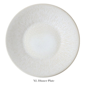 A large, round, white dinner plate with a textured radial pattern and subtle perle glaze from the Vuelta White Pearl Collection by Jars. "XL Dinner Plate" is displayed below the plate.