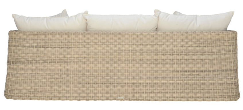 The Zeya Outdoor 3 Seater Sofa by Janus et Cie features a woven rattan design, straight backrest, and three white cushions. Shown from the back against a white background, this weather-resistant piece seats three comfortably.