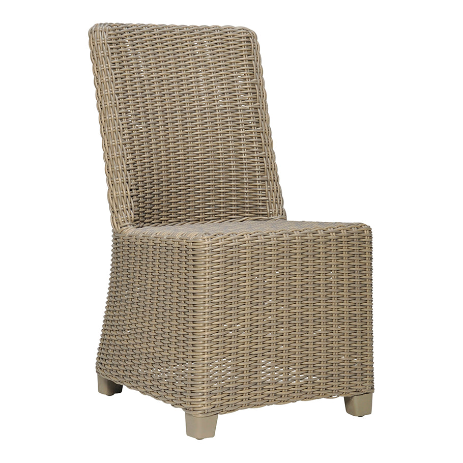The Zeya Outdoor Dining Side Chair by Janus et Cie is a tan, armless wicker chair with a high back, weather-resistant woven pattern, and four short legs—ideal for al fresco dining.