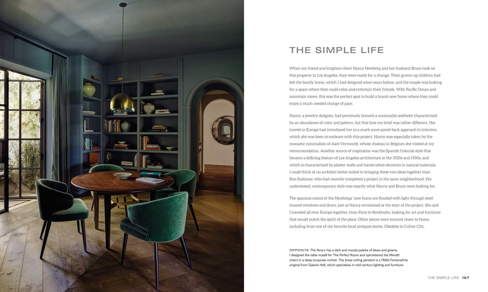 A modern dining room with a round wooden table surrounded by green velvet chairs, curated by an interior designer inspired by "Kathryn Ireland: A Life in Design" from Simon & Schuster. A large window with closed curtains is on one side, while a sideboard and various decor items are arranged around the room.