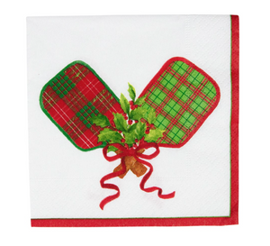 The Caspari Christmas Pickleball Cocktail Napkin features festive red and green plaid oven mitts crossed above holly on white triple-ply paper with red trim, printed using non-toxic inks—perfect for holiday gatherings.