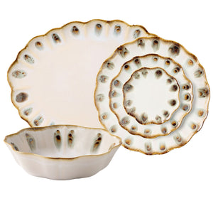 The Blue Pheasant Amoria Dinnerware Collection features a bowl, salad plate, and dinner plate—each ceramic with scalloped edges and white glaze accented by brown and blue speckles for vintage-inspired elegance.