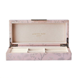 The Addison Ross Pink Chinoiserie Box from the Addison Ross Collection has a floral pattern with an open lid, revealing compartments lined in soft material for organizing jewelry.