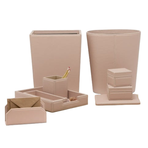 The Asby Desk Accessory Collection by Pigeon & Poodle features beige wastebaskets, trays, small boxes, a pencil holder, and an envelope holder, all elegantly arranged on a white background.