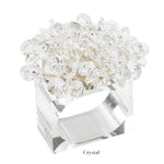 The Aster Napkin Ring by Kim Seybert features a clear rectangular beaded design with faceted glass beads on top and "Crystal" labeled below—an elegant accent for your table décor.