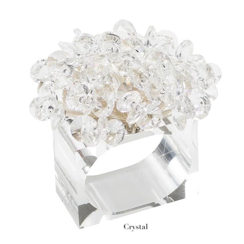 The Aster Napkin Ring by Kim Seybert features a clear rectangular beaded design with faceted glass beads on top and "Crystal" labeled below—an elegant accent for your table décor.