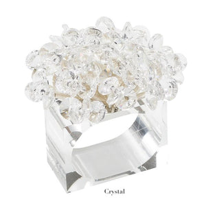 The Aster Napkin Ring by Kim Seybert features a clear rectangular beaded design with faceted glass beads on top and "Crystal" labeled below—an elegant accent for your table décor.