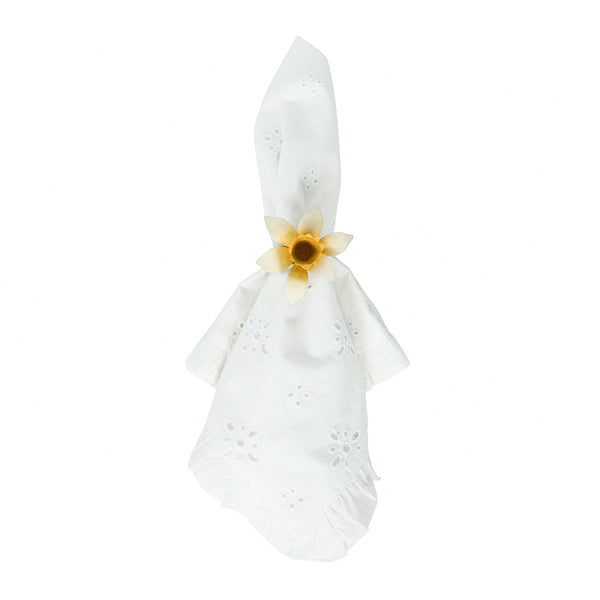 Add a touch of spring to your table with Juliska’s Meadow Walk Daffodil Napkin Ring Set, shown here holding a white napkin with floral eyelets against a white background—an elegant accent for seasonal entertaining.