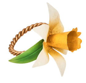 The Juliska Meadow Walk Daffodil Napkin Ring Set features gold rings with twisted bands, a green leaf, and a yellow and white daffodil—charming hand-painted metal accents to elevate your table settings.