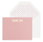 The Rose "Thank You" Card Set by Sugar Paper features a pink letterpress card with white text, displayed in front of a white envelope lined with a pink polka dot pattern.