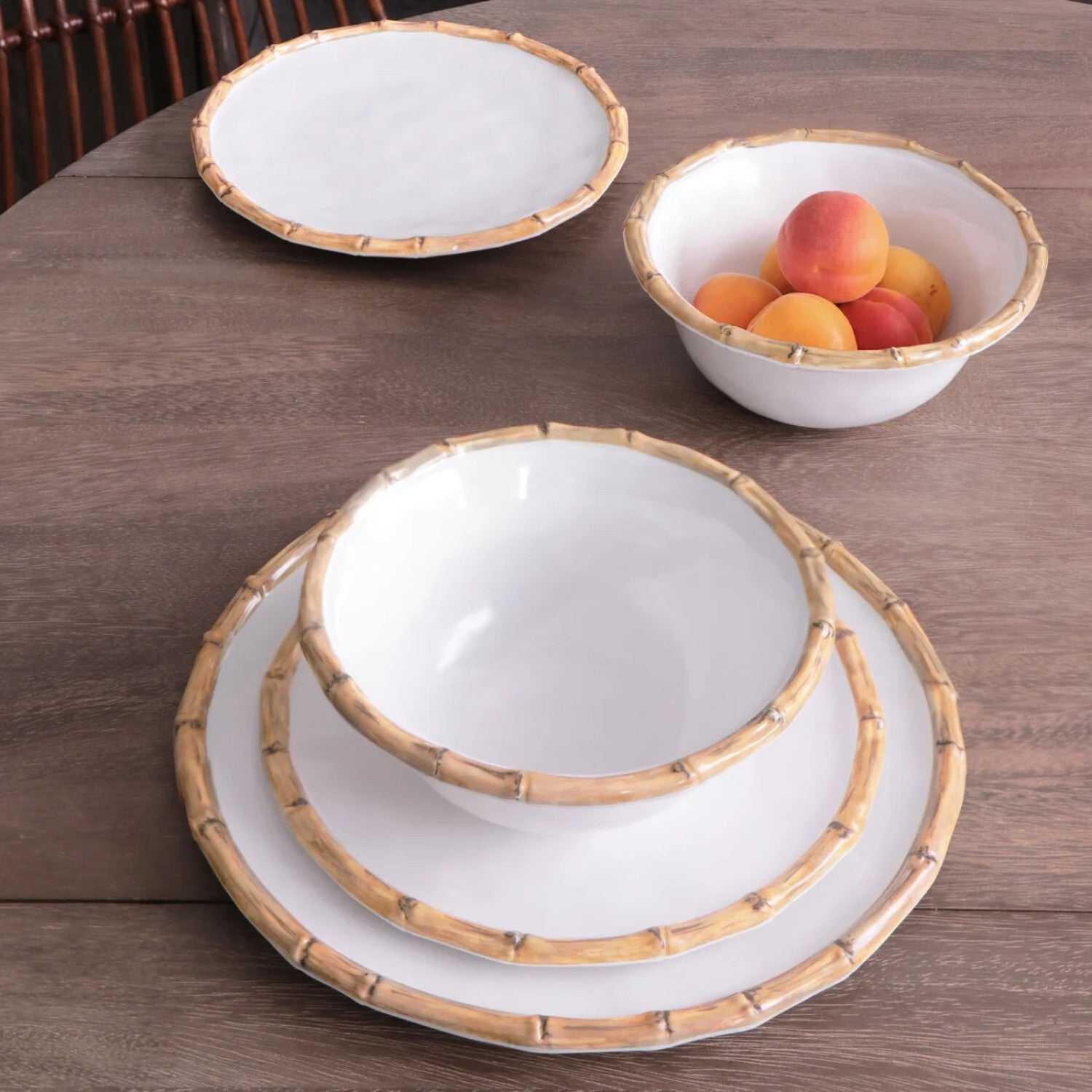 The Beatriz Ball Vida Natural Bamboo Dinnerware Collection features white, break resistant melamine plates and bowls with bamboo-patterned rims. Stylish and durable, they're perfect for serving fruit or meals on your table.