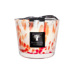 The Baobab Collection Pearls Coral Candle by Baobab features hand-blown glass with an orange and white marbled design, a black logo label, and is topped with a black ribbon.