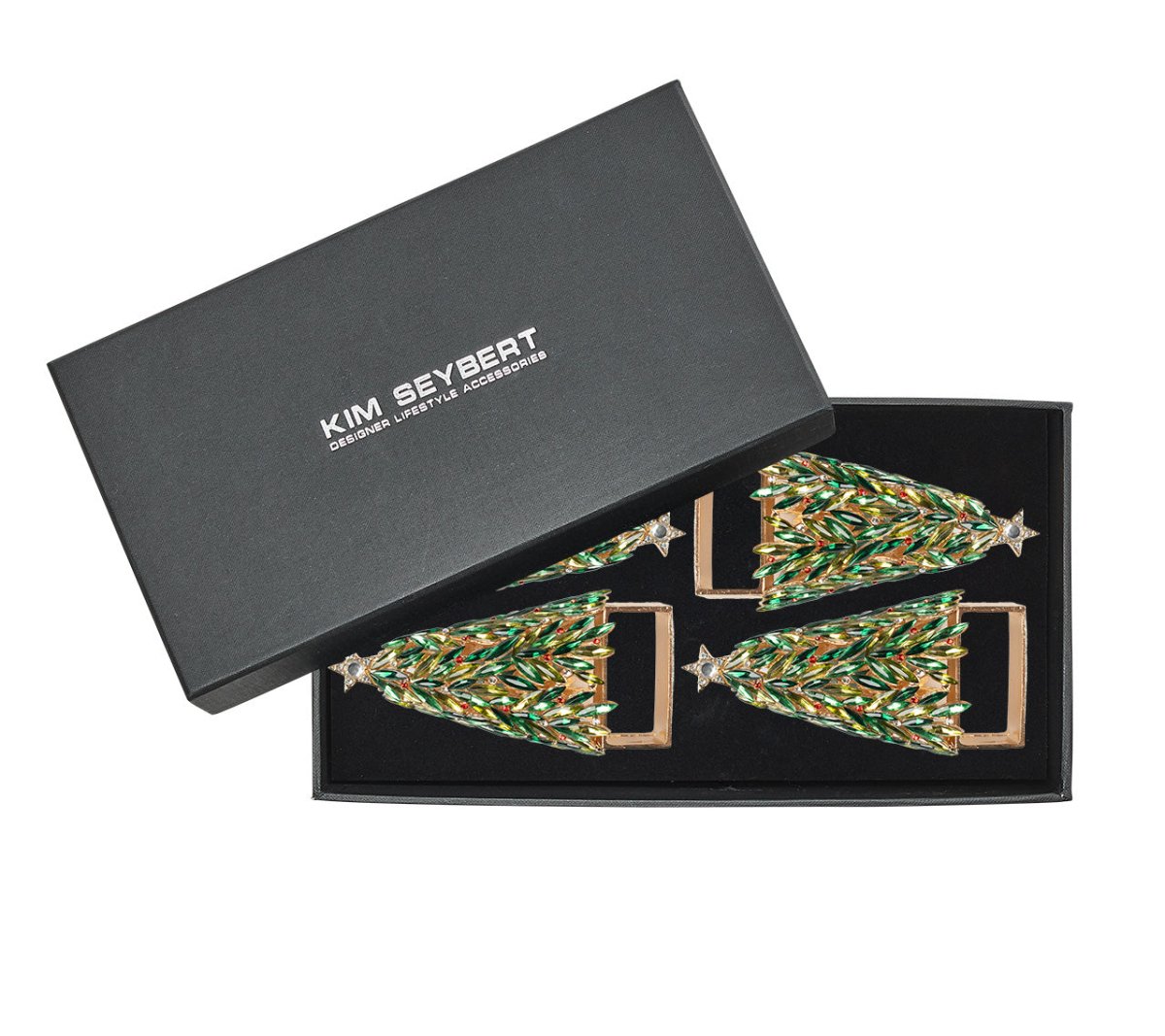 The Kim Seybert Christmas Tree Napkin Ring Set includes four jeweled rings in a black box, decorated with green, gold, and silver beads—ideal for a festive table setting.