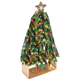 The Kim Seybert Christmas Tree Napkin Ring Set features festive green and gold details, red accents, and a gold star—perfect for adding holiday sparkle to your table setting.