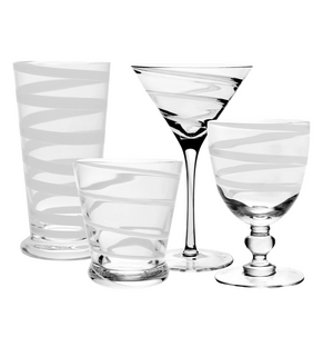 Four elegant white spiral glasses from the Bella Bianca Collection by William Yeoward Crystal—a highball, martini, tumbler, and goblet—are grouped on a white background. Proposition 65 warning: this product may expose you to harmful chemicals.