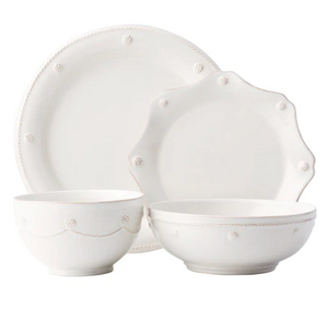 A set of four white ceramic dishes from the Juliska Berry & Thread Classic Whitewash Dinnerware Collection, featuring a dinner plate, scalloped-edge plate, pasta bowl, and small bowl with subtle textured details.