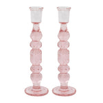 The Provence Candlestick Set by Juliska features two pink mouth-blown glass candlesticks with a stacked, bubble-like design—ideal for adding chic charm to your decor.