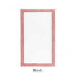 The Graccioza Egoist Border Bath Rug features a thick blush pink customizable border and white center, crafted from soft Egyptian cotton. Displayed on a white background with “Blush” written below the rug.