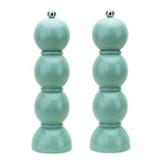 Hive’s Bobbin Salt & Pepper Grinder Set features glossy light blue-green lacquer, a rounded bobbin design, silver knobs, and durable ceramic grinders.