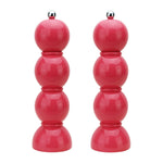 The Hive Bobbin Salt & Pepper Grinder Set features glossy red lacquered mills with ceramic grinders and silver knobs, shown side by side against a white background.