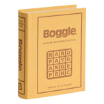 A yellow fabric-wrapped box resembling a book, labeled "Vintage Bookshelf Board Games" by WS Game Company, features a Boggle letter grid on the cover and evokes a classic board game from their Vintage Bookshelf Collection.