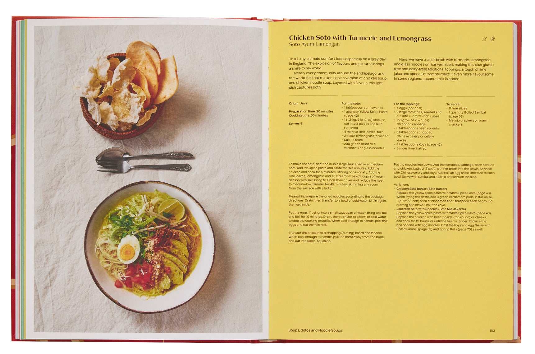 An open Phaidon cookbook displaying a recipe for chicken soto with turmeric and lemongrass and a plated example of the finished dish with utensils.
