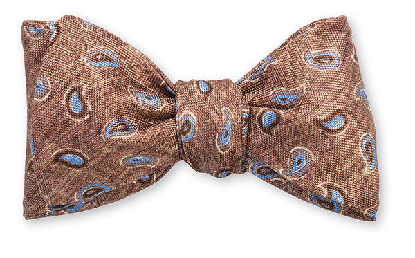 A hand-made R. Hanauer Brinkley Pine bow tie with paisley design on a white background.